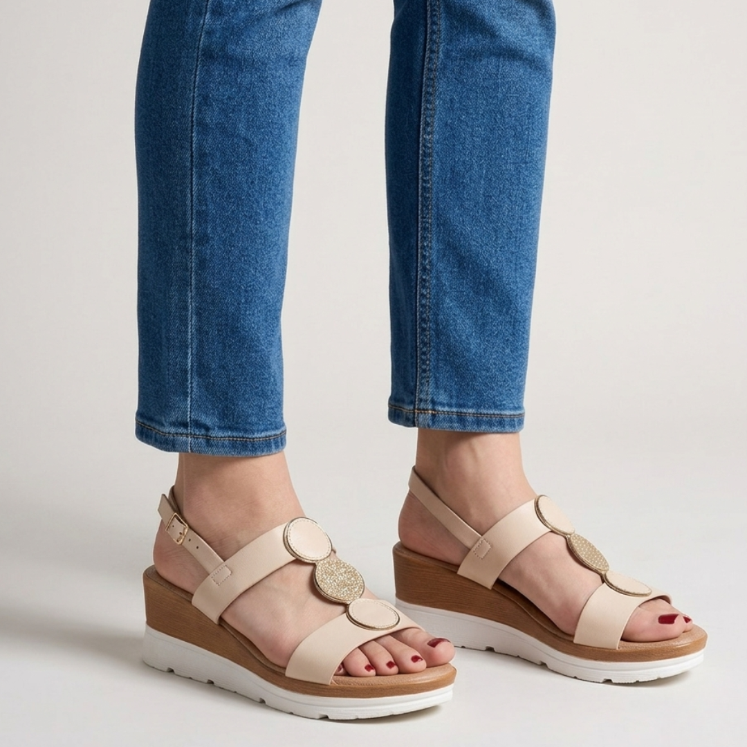 Gelvane beige wedge sandal with decorative disc detail - front view