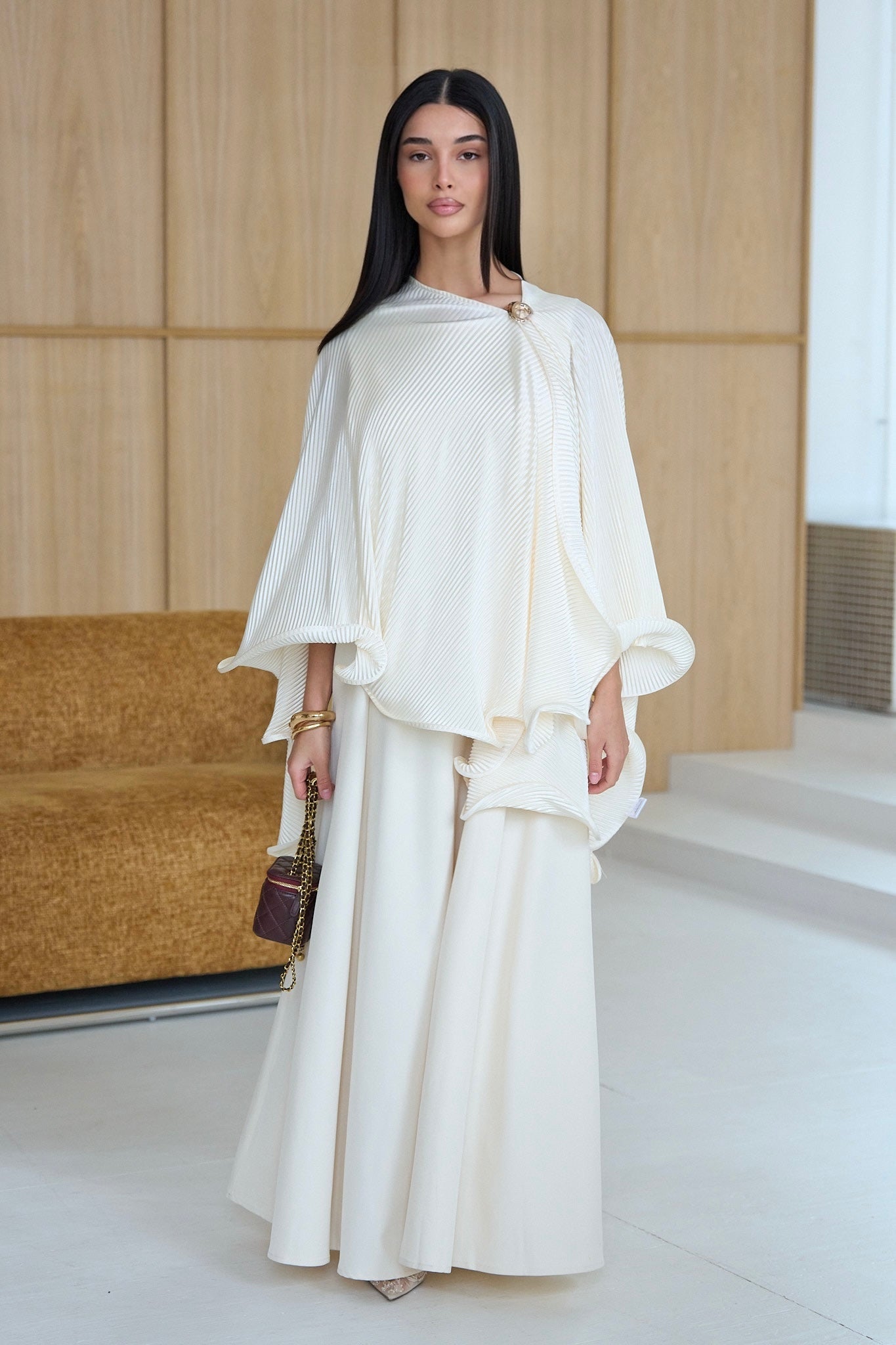 Orbane cream ruffle poncho drape view